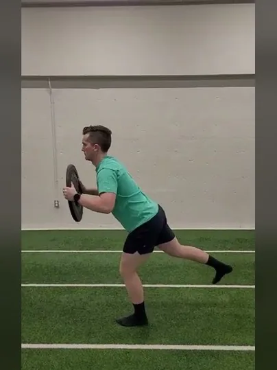 Single Leg Hip Hinge with Weighted Plate exercise demonstration