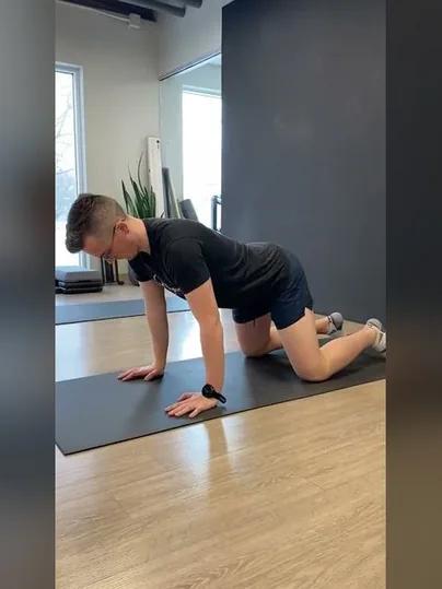 Quadruped Rocking Wrist Extension - Side View exercise demonstration