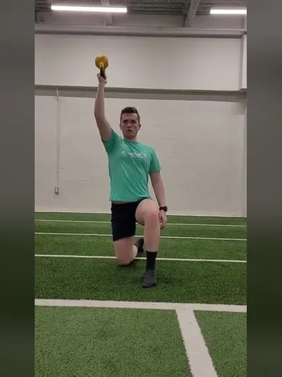 Kneeling Kettlebell Press exercise demonstration