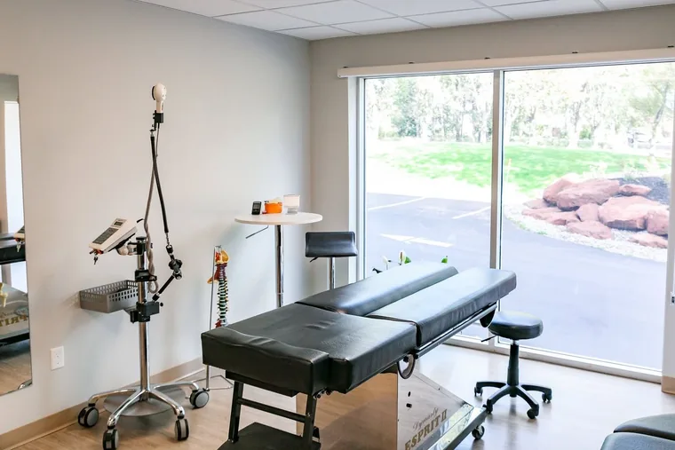 Chiropractic table beside the window