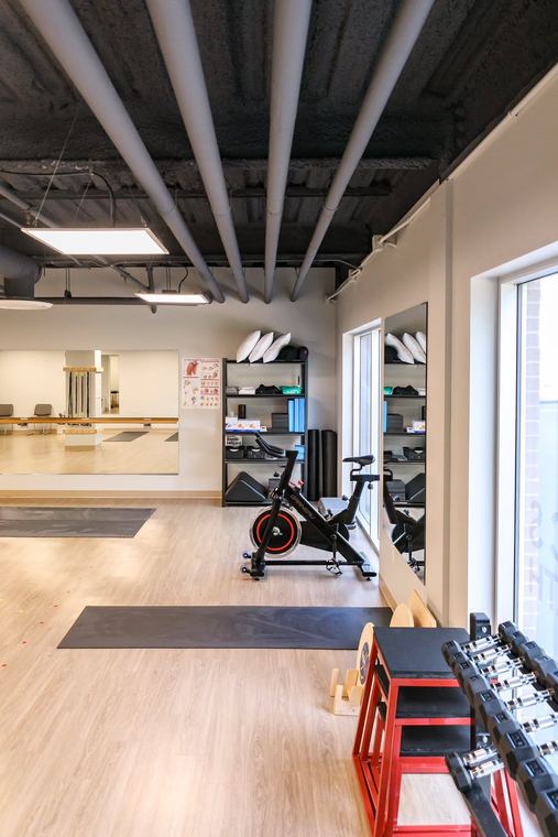 Spin bike and dumbbell rack on the training floor