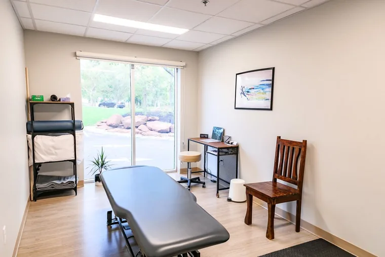 Treatment room with plinth and seating